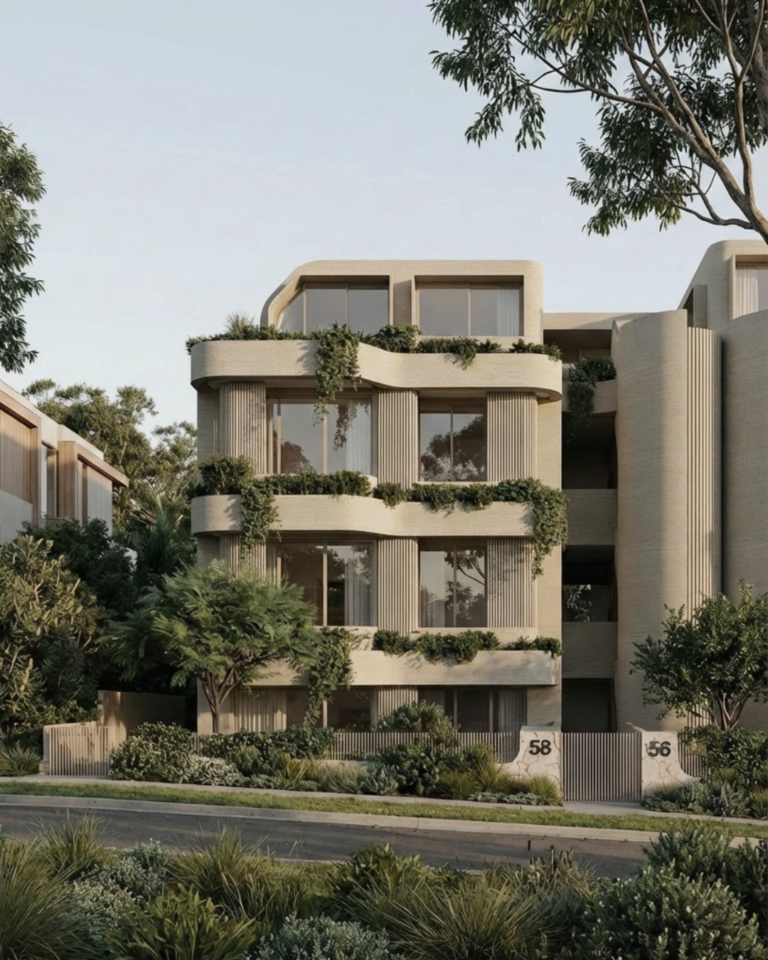 56-58 Bream: planted terraces stepping down a cream masonry facade at golden hour